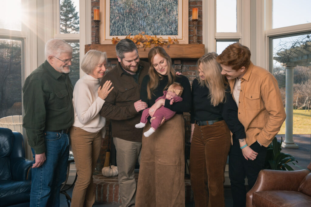 Extended family photo with a newborn shot indoors in Lincoln, MA