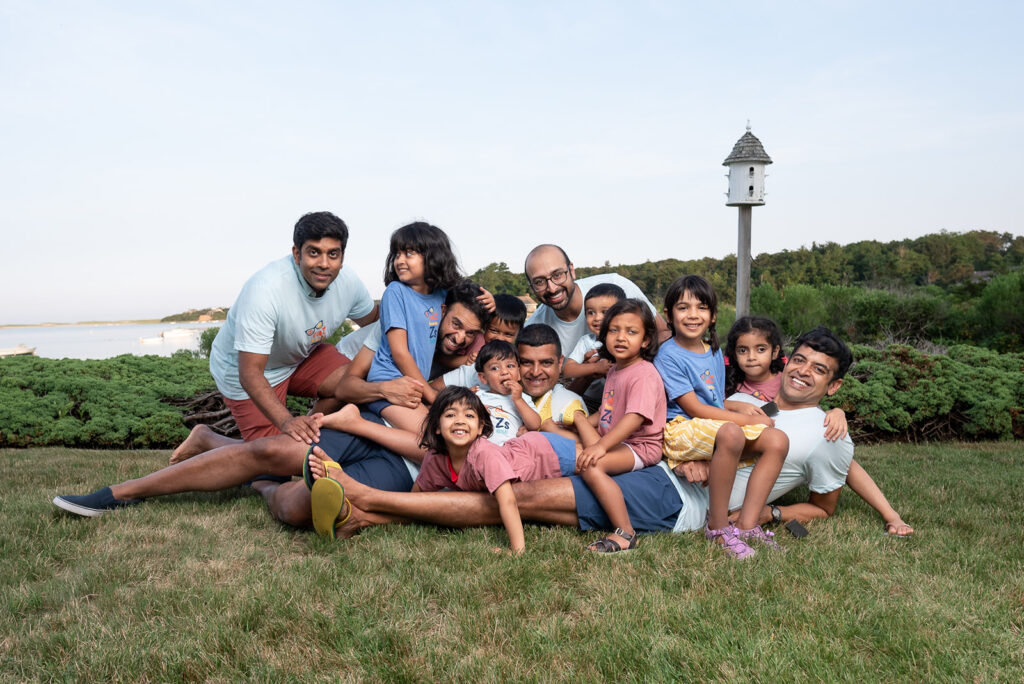 An extended family of multiple generations during a summer photo session in Boston by Boston photographer Corey Flint.