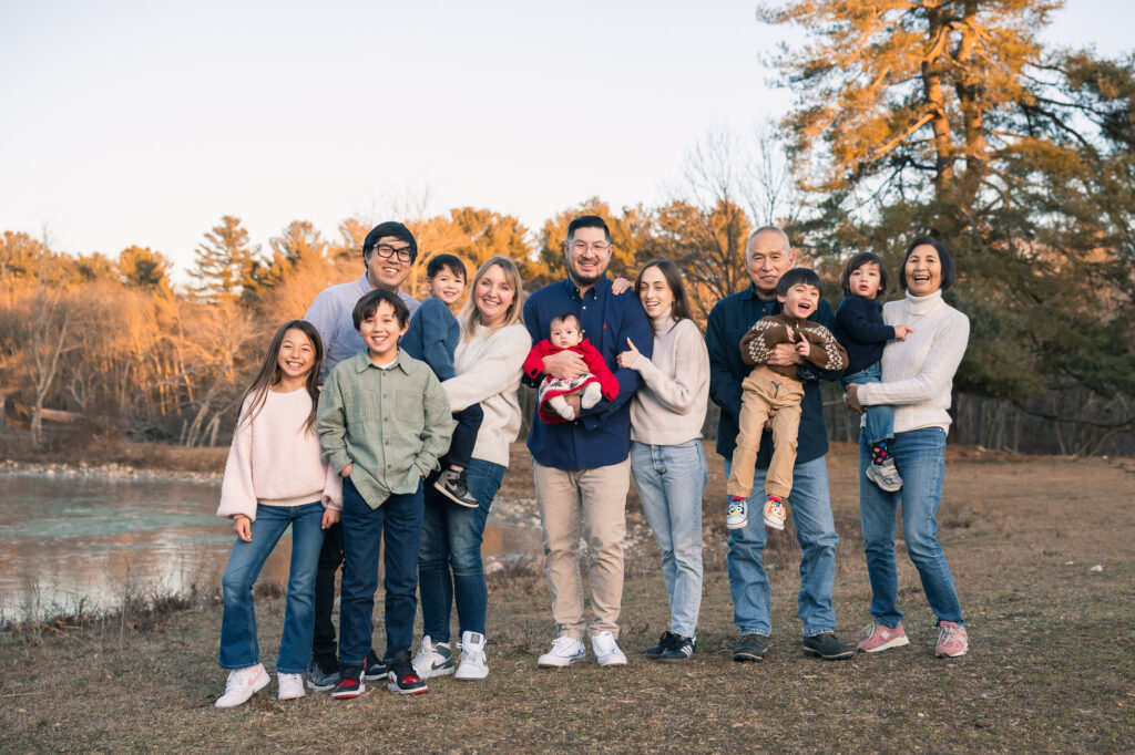 Large extended family of twelve people at a winter New England outdoor photo session